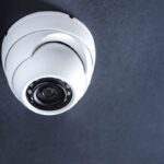 Dome security camera installed in ceiling of home